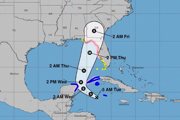 Map showing the projected path of a tropical storm or hurricane, including various forecasted positions marked by timestamps and intensity categories (S for storm, H for hurricane, M for major hurricane) across the Gulf of Mexico and southeastern United States.
