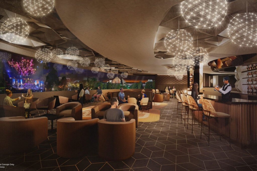 Modern indoor lounge with geometric lighting fixtures, comfortable seating, a bar area, and large windows offering a view of an outdoor fireworks display.