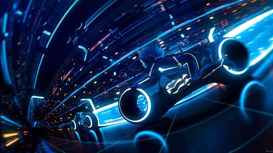 Futuristic scene depicting two light cycle racers speeding through a neon-lit, digital grid environment.