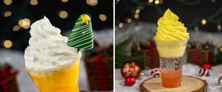 Two festive desserts in clear cups; the left features a yellow base with white whipped cream topped by a green-striped cone and a star, while the right has a layered yellow and orange topping with a fizzy drink beneath, decorated with festive ornaments in the background.
