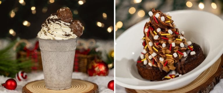 A festive dessert scene featuring a silver cup filled with a creamy dessert topped with whipped cream and chocolate balls on the left, and a bowl of chocolate brownie stacked high and decorated with colorful sprinkles and marshmallows on the right, with holiday decorations in the background.