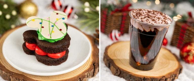 A festive dessert displayed on the left, featuring two chocolate cake layers filled with red cream and topped with a decorative white chocolate piece resembling a mouse ear. On the right, a clear cup filled with a dark chocolate dessert, topped with whipped cream and sprinkled with chocolate shavings, set on a wooden slice. Background elements include Christmas decorations.