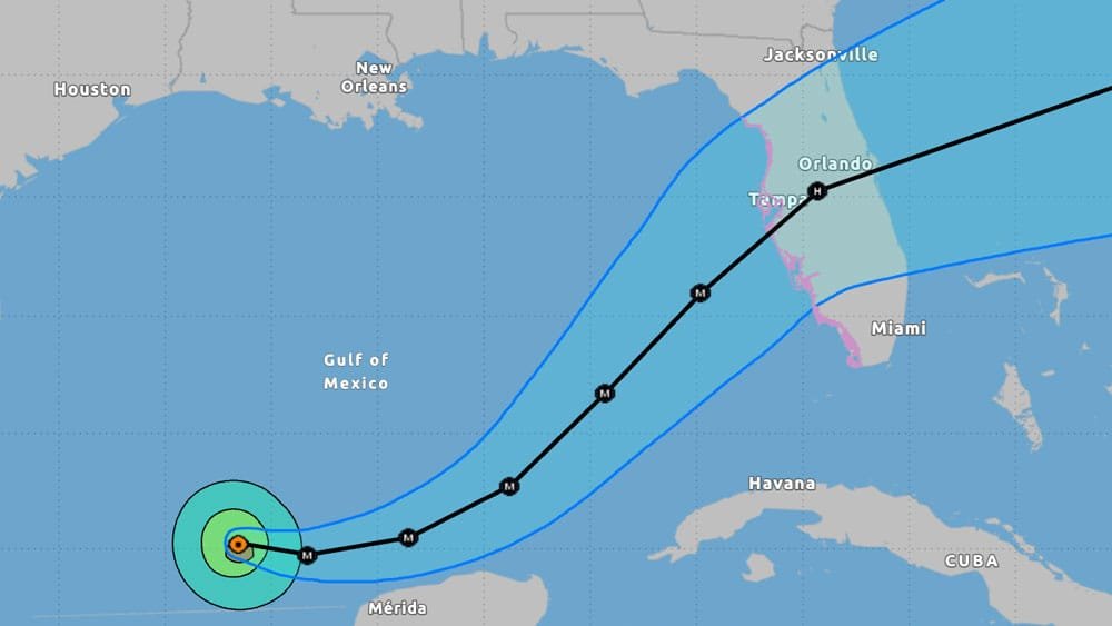 Map showing a hurricane's projected path through the Gulf of Mexico, with notable locations like New Orleans, Houston, and various cities in Florida marked, along with cone boundaries indicating storm's potential trajectory.