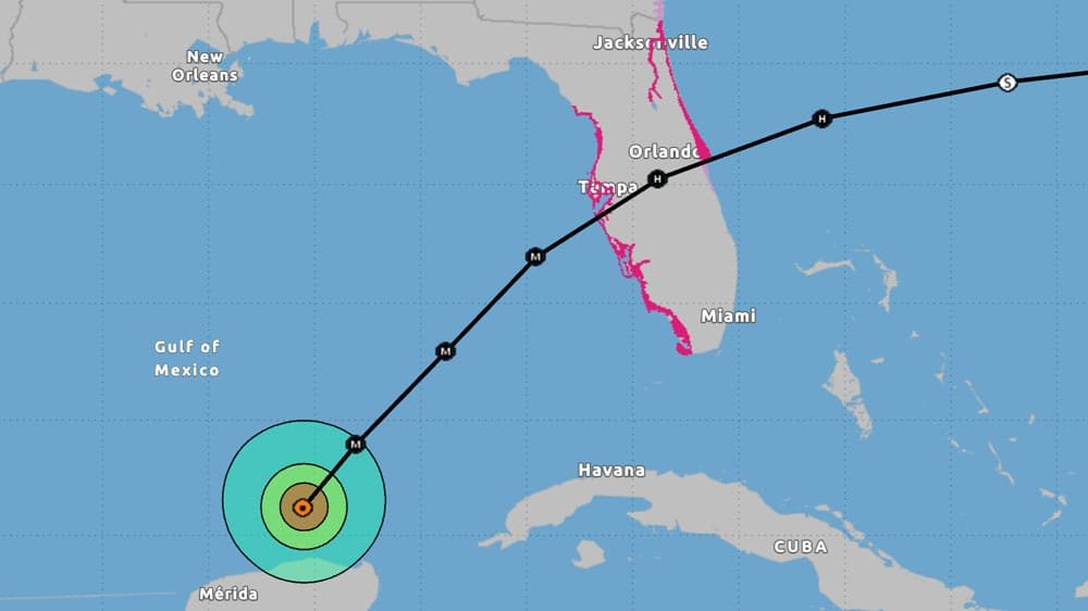 Map showing a hurricane path in the Gulf of Mexico toward Florida, with locations labeled including New Orleans, Merida, Miami, Tampa, Orlando, and Jacksonville. The center of the hurricane is illustrated with concentric circles indicating intensity.