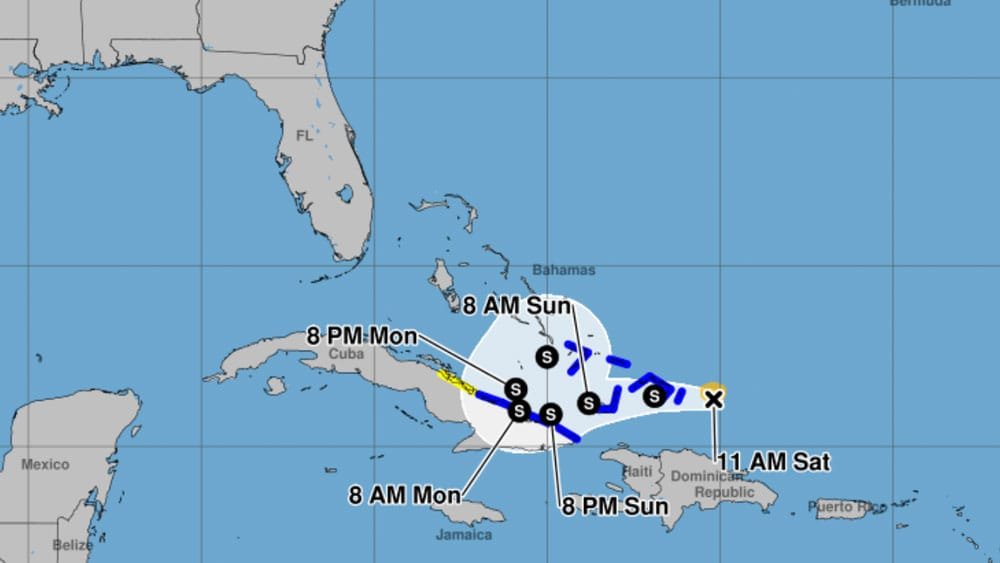 A weather map showing a tropical storm or hurricane path, with tracking points labeled for various times over the course of a weekend, including locations near Florida, Cuba, and the Bahamas.