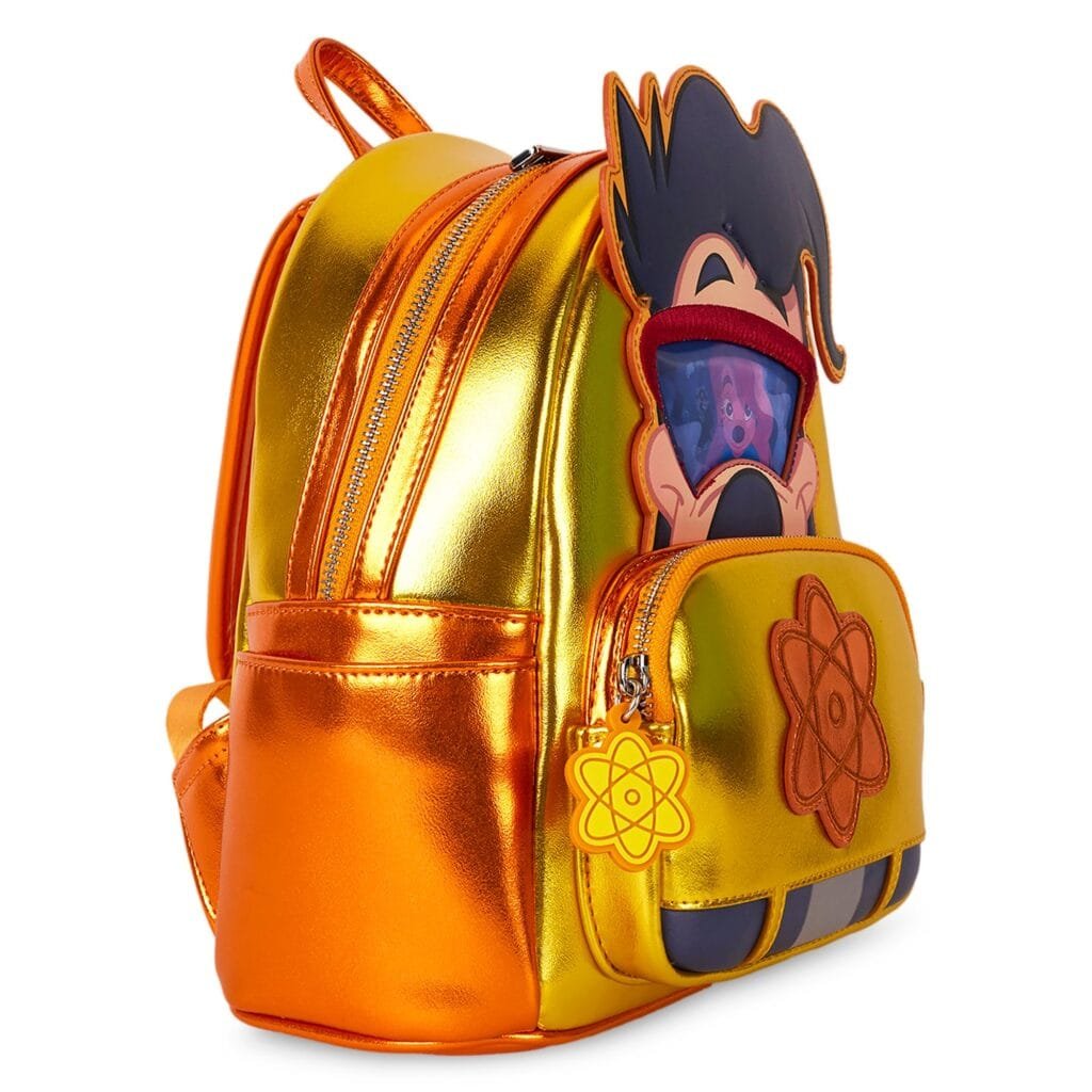 A shiny orange and gold backpack featuring a cartoon character's face on the front pocket, with the character looking surprised and wearing glasses. The bag has multiple zippered compartments and a decorative atom symbol charm attached to the zipper.