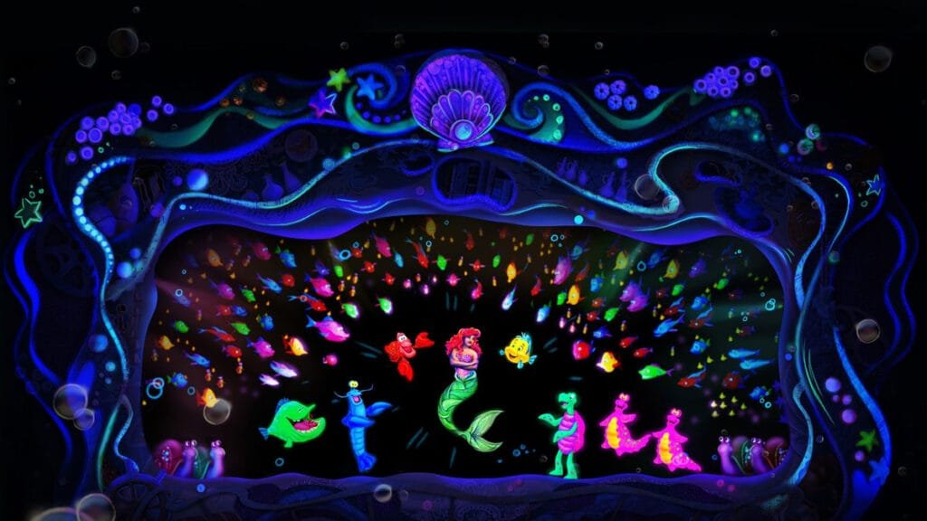 A colorful underwater scene featuring a mermaid surrounded by various animated sea creatures, including fish and a crab, set against a dark background with bubbles and vibrant ocean motifs.