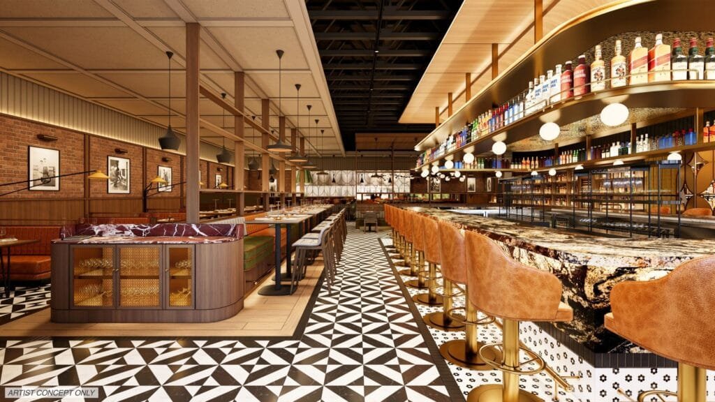 A modern restaurant interior featuring wooden beams and pendant lights, with a long bar lined with brown leather stools and a polished marble countertop. The floor displays a geometric black and white tile pattern, while the back wall showcases shelves of colorful liquor bottles and framed photographs. Cozy seating areas and tables are arranged along the sides.